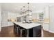 Gourmet kitchen features a large island, stainless steel appliances, and a breakfast bar at 4215 Homestead Ridge Dr, Cumming, GA 30041