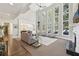 Bright living room with tall windows, a fireplace, and stylish furnishings at 4215 Homestead Ridge Dr, Cumming, GA 30041