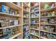 Walk-in pantry with shelves stocked with food items and storage bins at 4215 Homestead Ridge Dr, Cumming, GA 30041