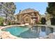 Back of house with a luxurious in-ground pool, sun loungers, and beautifully landscaped surroundings at 4215 Homestead Ridge Dr, Cumming, GA 30041