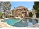 Back of house with a luxurious in-ground pool, sun loungers, and beautifully landscaped surroundings at 4215 Homestead Ridge Dr, Cumming, GA 30041