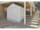 Backyard shed is nestled under the stairs leading up to the deck, offers convenient storage solution with easy access at 4215 Homestead Ridge Dr, Cumming, GA 30041