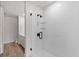 Bathroom featuring a tiled shower with modern fixtures and glass door at 108 Park Place Unit 104, Decatur, GA 30030