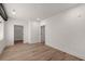 Bedroom with hardwood floors, white trim, and a doorway leading to a walk-in closet at 108 Park Place Unit 104, Decatur, GA 30030