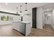 Modern kitchen with hardwood floors and stainless steel appliances at 108 Park Place Unit 104, Decatur, GA 30030