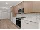 Kitchen with stainless steel appliances and a subway tile backsplash at 108 Park Place Unit 104, Decatur, GA 30030