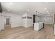 Open living space featuring hardwood floors, with views into the kitchen at 108 Park Place Unit 104, Decatur, GA 30030