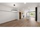 Living room featuring hardwood floors, neutral paint, and modern lighting at 108 Park Place Unit 104, Decatur, GA 30030