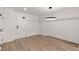 Spacious living area with hardwood floors and a modern light fixture at 108 Park Place Unit 104, Decatur, GA 30030
