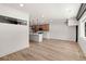 Spacious open-concept floor plan with hardwood floors, connecting the living room and kitchen at 108 Park Place Unit 104, Decatur, GA 30030
