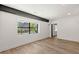 Bright living room with hardwood floors and large window providing ample natural light with exterior views at 108 Park Place Unit 104, Decatur, GA 30030