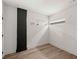 Empty room featuring wood floors, white walls, and modern lighting at 108 Park Place Unit 104, Decatur, GA 30030