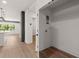 Interior shot of a utility room featuring hardwood floors and washer/dryer hookups at 108 Park Place Unit 104, Decatur, GA 30030