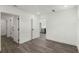 This bedroom has hardwood floors, white walls, and a bathroom and closet at 108 Park Place Unit 304, Decatur, GA 30030