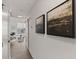 Hallway with hardwood floors, modern paintings, and natural light coming through the window at 108 Park Place Unit 304, Decatur, GA 30030