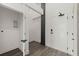 Hallway features hardwood floors, white walls, and access to a washer/dryer and unit entrance at 108 Park Place Unit 304, Decatur, GA 30030