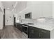 Modern kitchen boasts two-tone cabinets, stainless appliances, and a minimalist design aesthetic at 108 Park Place Unit 304, Decatur, GA 30030
