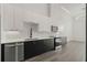Contemporary kitchen featuring sleek two-tone cabinets, stainless appliances, and quartz countertops at 108 Park Place Unit 304, Decatur, GA 30030