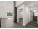 Open living space with hardwood floors, large windows, modern lighting, and an open kitchen view at 108 Park Place Unit 304, Decatur, GA 30030