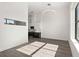 Bright living room with hardwood floors, white walls, and windows at 108 Park Place Unit 304, Decatur, GA 30030