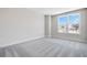Inviting bedroom with a window offering outside views, carpet flooring, and neutral wall colors at 2572 Silver Star Ne Dr, Marietta, GA 30066