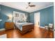 Comfortable bedroom featuring hardwood floors, ample natural light and ceiling fan at 637 Linwood Ne Ave, Atlanta, GA 30306