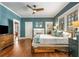 Spacious bedroom with wooden floors, a fireplace, and bright natural light at 637 Linwood Ne Ave, Atlanta, GA 30306