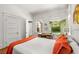 Bright bedroom with hardwood floors, a cozy desk, and a view to the backyard at 637 Linwood Ne Ave, Atlanta, GA 30306