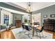 Elegant dining room featuring stylish lighting, hardwood floors, and a glass-top table with seating for six at 637 Linwood Ne Ave, Atlanta, GA 30306