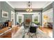 Elegant dining room featuring hardwood floors, stylish lighting, and comfortable seating with ample natural light at 637 Linwood Ne Ave, Atlanta, GA 30306