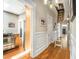 Hallway with wood floors, light fixtures and access to other rooms at 637 Linwood Ne Ave, Atlanta, GA 30306