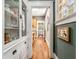 Hallway view with hardwood floors, white trim, and built-in cabinets at 637 Linwood Ne Ave, Atlanta, GA 30306
