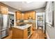 Bright kitchen featuring wood cabinets, granite counters, and stainless steel appliances at 637 Linwood Ne Ave, Atlanta, GA 30306