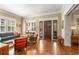 Bright and airy living room with hardwood floors, large windows, and an inviting seating area by the front door at 637 Linwood Ne Ave, Atlanta, GA 30306