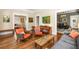 Inviting living space with hardwood floors, multiple seating areas, and seamless transition to other rooms at 637 Linwood Ne Ave, Atlanta, GA 30306