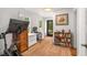 Stylish home office with a peloton, desk, and shelving with artwork at 637 Linwood Ne Ave, Atlanta, GA 30306