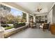 Relaxing front porch with comfortable seating, a ceiling fan, and picturesque views of the landscaped surroundings at 637 Linwood Ne Ave, Atlanta, GA 30306