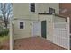 Backyard patio area with privacy fence and view of home's siding at 6691 Colchester Pl, Norcross, GA 30093