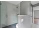 Modern bathroom features glass enclosed shower with sleek fixtures and tiling at 6691 Colchester Pl, Norcross, GA 30093