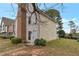 Charming townhouse showcasing a mix of siding and brick with a well-maintained lawn at 6691 Colchester Pl, Norcross, GA 30093