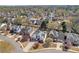 An aerial view of the neighborhood highlighting well-maintained homes with mature trees and landscaping at 1055 Crabapple Parc Dr, Roswell, GA 30076