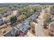 An aerial view showcasing the charming homes and tree-lined streets in a quiet residential neighborhood at 1055 Crabapple Parc Dr, Roswell, GA 30076