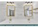Modern bathroom featuring double sinks, marble backsplash, elegant gold fixtures, and floating shelves at 1055 Crabapple Parc Dr, Roswell, GA 30076