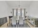 Formal dining room with modern light fixture, accent wall and mirror furniture at 1055 Crabapple Parc Dr, Roswell, GA 30076