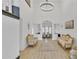 Bright foyer featuring chandelier lighting, high ceilings and luxury vinyl plank flooring at 1055 Crabapple Parc Dr, Roswell, GA 30076