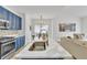 Kitchen featuring a white quartz island, stainless steel appliances, and blue cabinets at 1055 Crabapple Parc Dr, Roswell, GA 30076