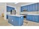 Modern kitchen with stainless steel appliances, white countertops, and navy blue cabinetry at 1055 Crabapple Parc Dr, Roswell, GA 30076