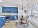 Eat in kitchen with stainless steel appliances, and blue cabinets with gold accents at 1055 Crabapple Parc Dr, Roswell, GA 30076