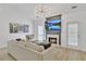 Cozy living room with a fireplace, modern furnishings, and lots of natural light at 1055 Crabapple Parc Dr, Roswell, GA 30076