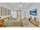 Bright bedroom with a modern bed, sliding door, recessed lights, and mountain artwork on the wall at 1055 Crabapple Parc Dr, Roswell, GA 30076